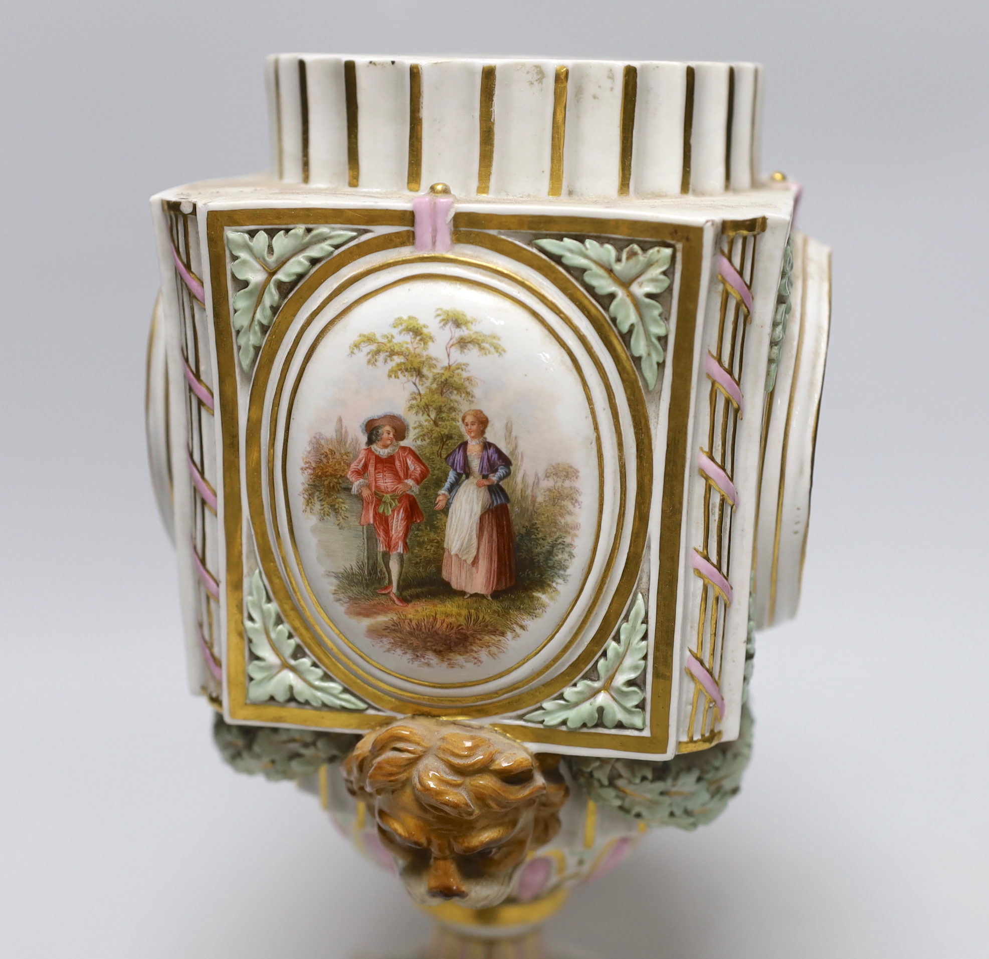 A late 19th century Meissen clock of square form with Watteau scenes and lion mask handles, top missing, 26cm